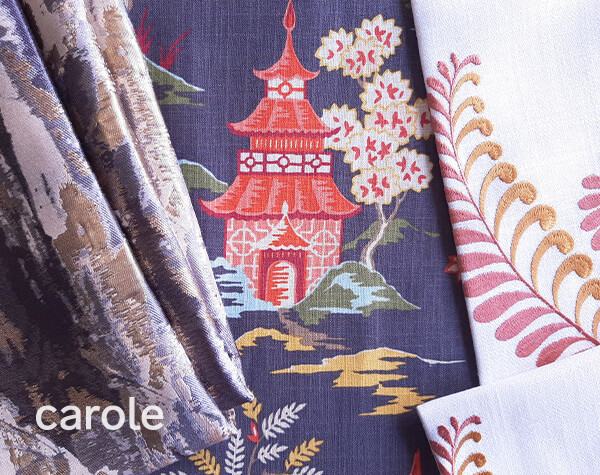 An overlapping arrangement of decorative fabrics: a jacquard, a print and an embroidery.