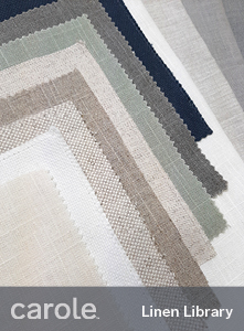 An arrangement of near-solid linen and linen blend fabrics in neutral colors.