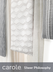 An arrangement of sheer fabrics in subtle neutral patterns.
