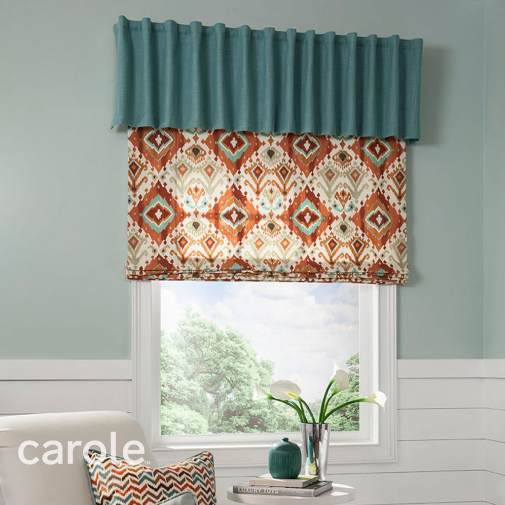 Teal Brooklyn Rod Mounted Valance top treatment over Flat Roman Shades in a southwestern pattern in a simple sitting area.