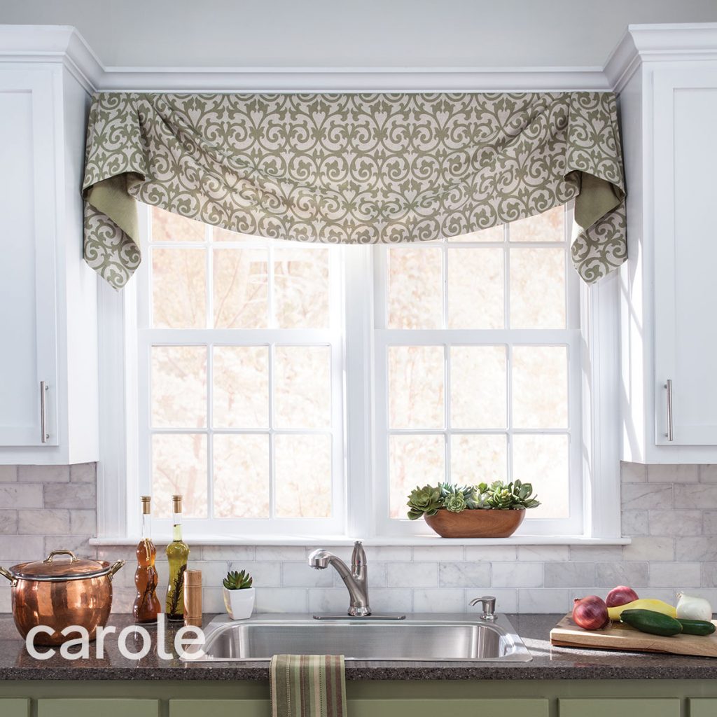 Kennedy Board Mounted Valance top treatment in a sage and ivory scroll pattern over a kitchen window.
