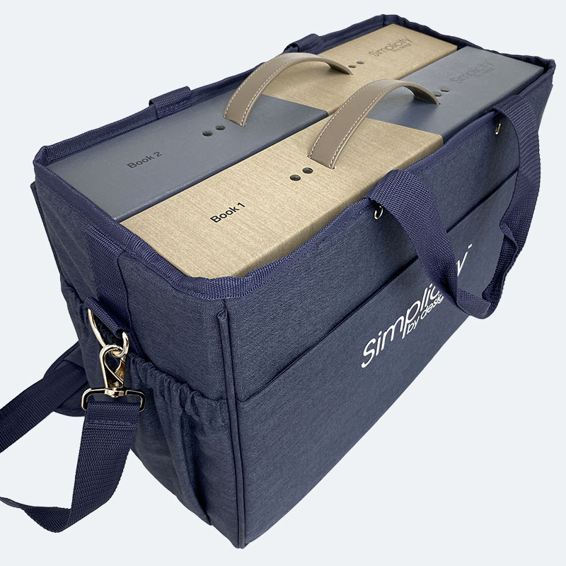 The Simplicity By Design program from Carole Fabrics includes two fabric sample books inside a sturdy canvas carrying case.