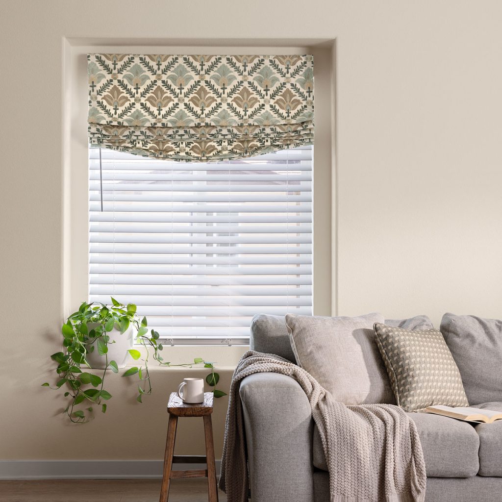 A comfortable neutral living room featuring a Soft Faux Roman in a large scale embroidery pattern.