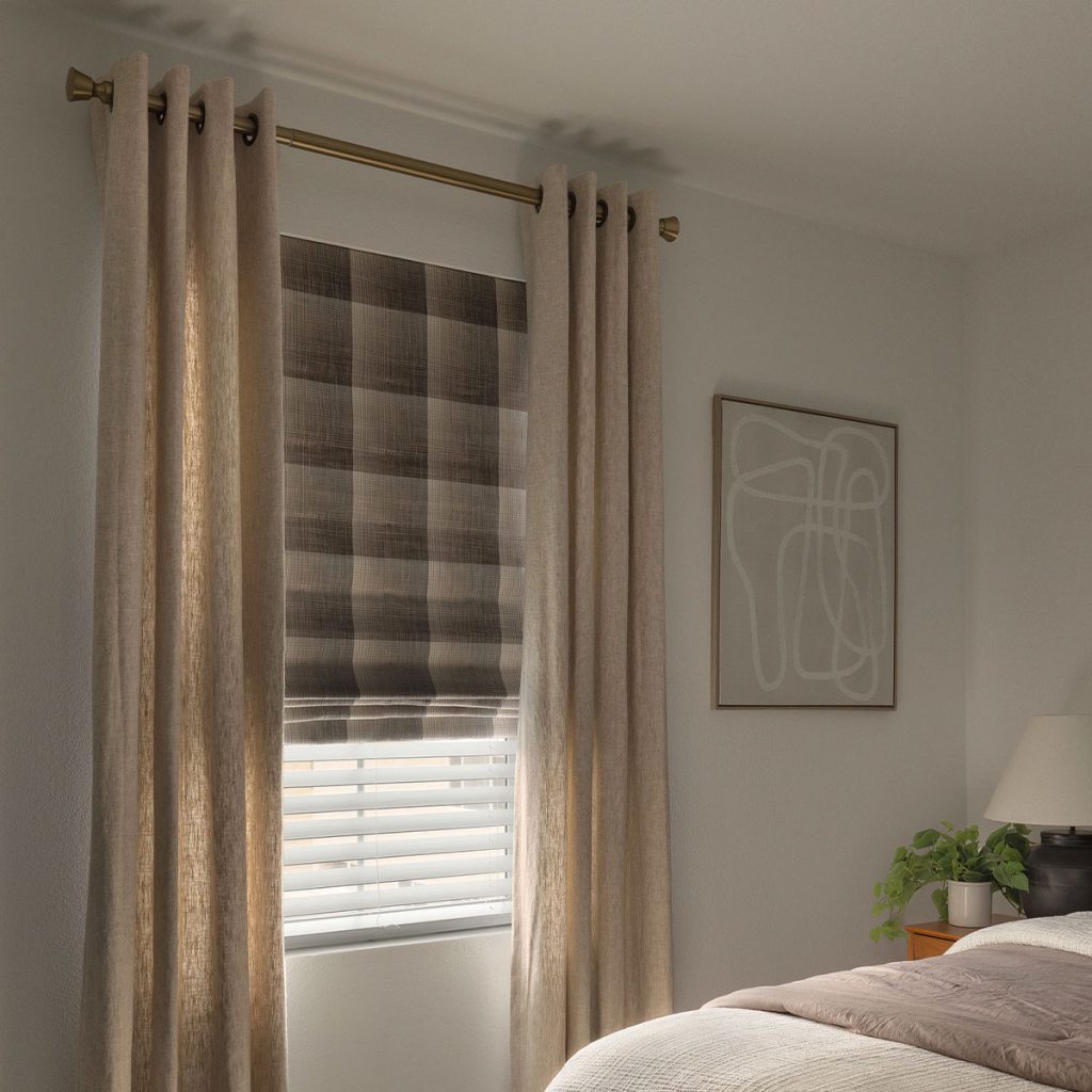 A neutral bedroom featuring a soft Flat Roman shade layered under Grommet Heading EZ Panels.