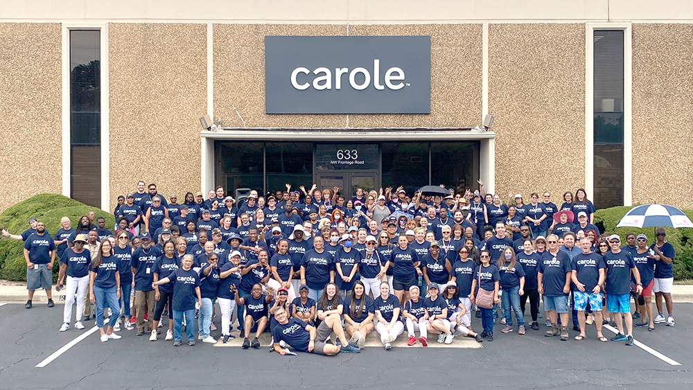 Carole Fabrics employees in front of our facility, ready for a team charity walk in 2022.